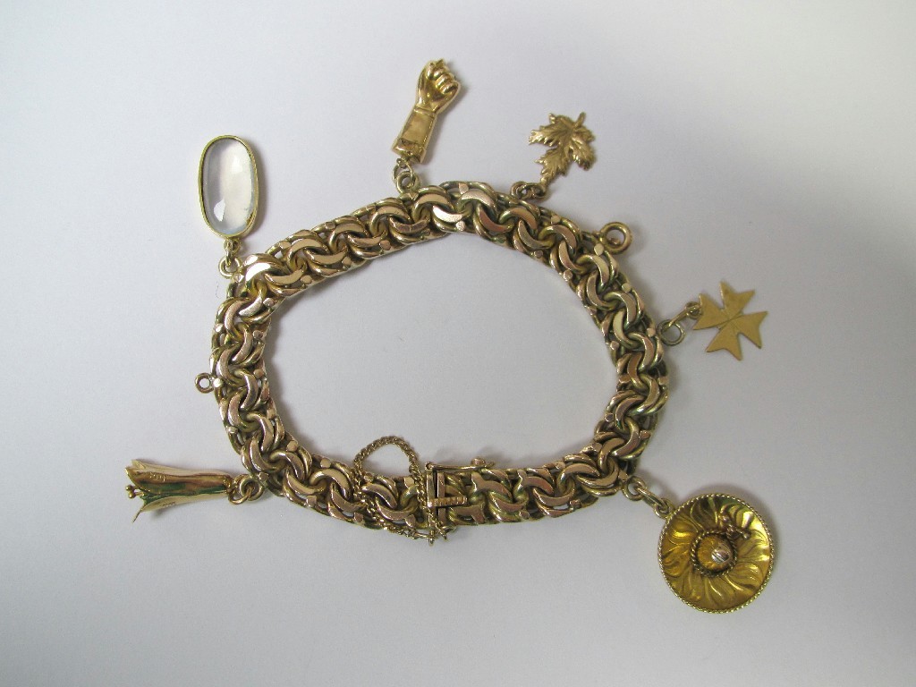 Appraisal: Fourteen carat gold charm bracelet Approximately gms