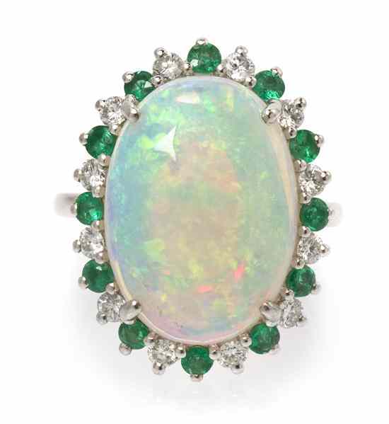 Appraisal: A Platinum Opal Emerald and Diamond Ring containing one oval