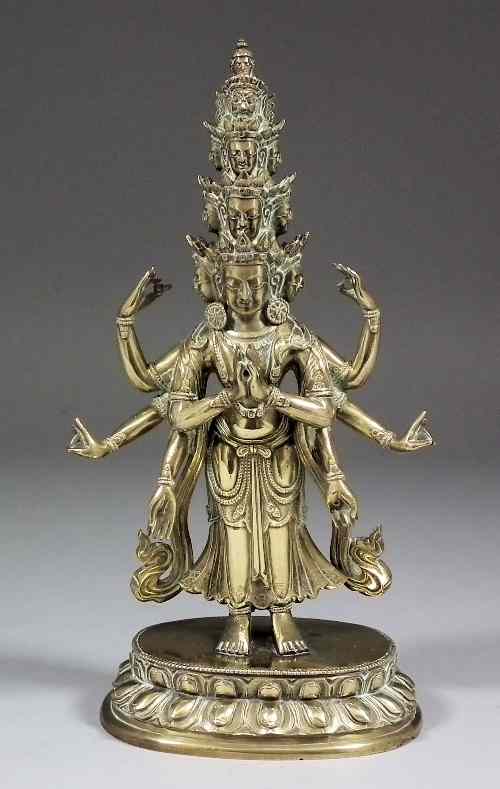 Appraisal: An Indian cast brass standing figure of an eight armed