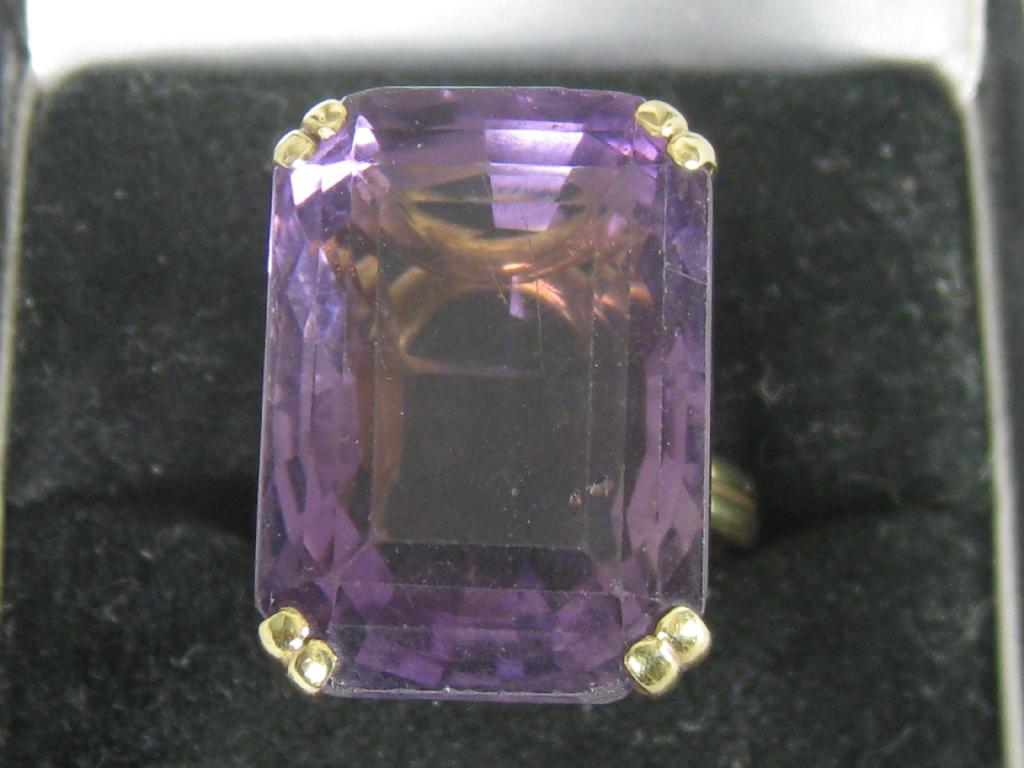 Appraisal: A Contemporary Amethyst Ring the large step-cut stone claw set