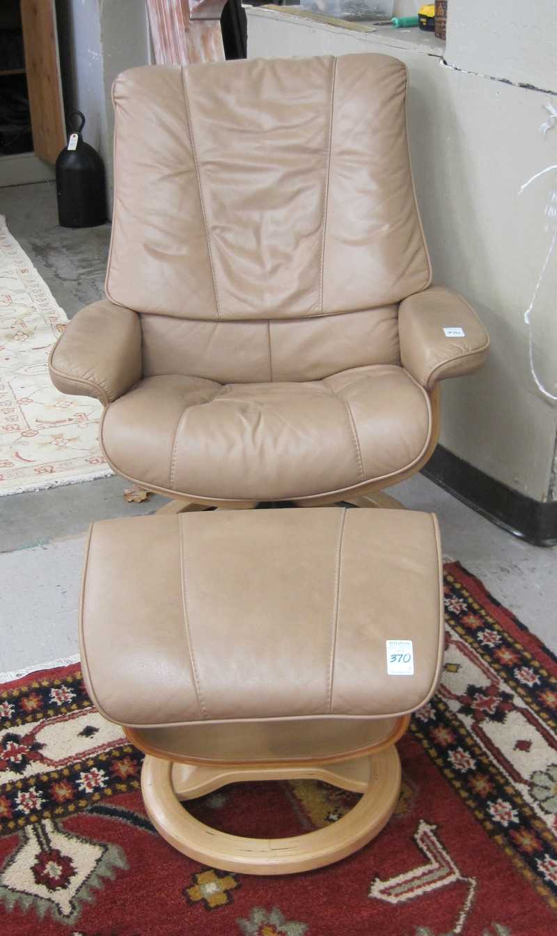 Appraisal: MODERN LEATHER RECLINING LOUNGE CHAIR WITH MATCHING FOOTSTOOL Ekornes retro