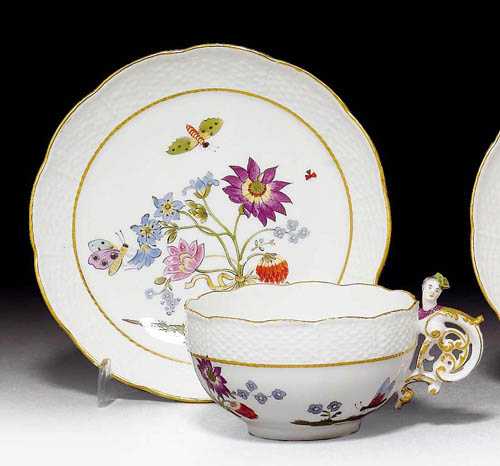 Appraisal: CUP AND SAUCER WITH 'BIENENMUSTER' Meissen circa Rococo handle heightened