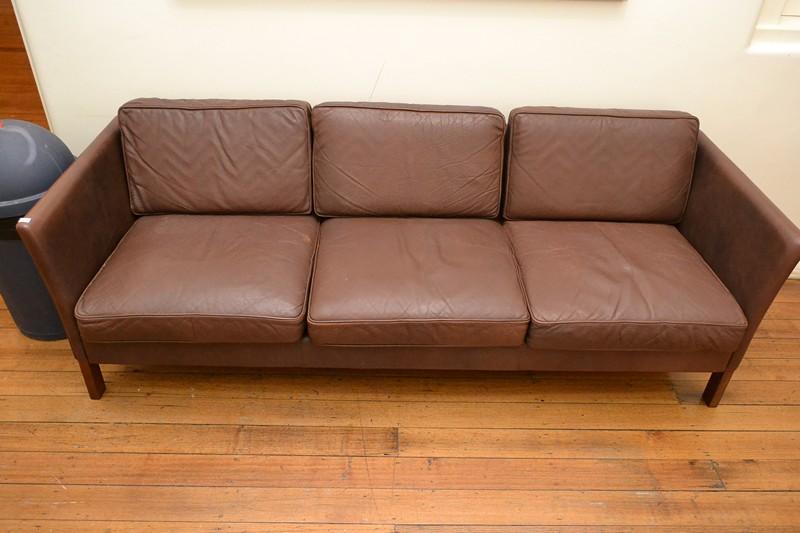 Appraisal: AN ERIK JORGENSEN THREE SEAT BROWN LEATHER SOFA AN ERIK