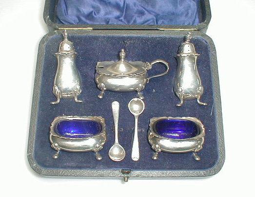 Appraisal: A George V silver cruet set comprising a pair of