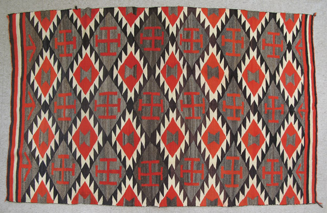 Appraisal: NAVAJO TRANSITIONAL BLANKET the natural grey ground woven with three