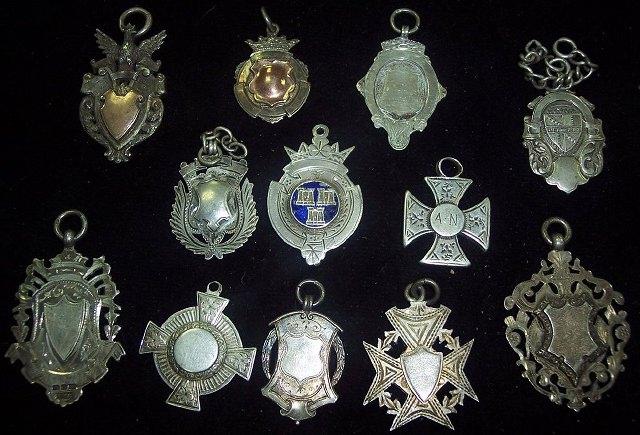 Appraisal: Sundry silver medallions many with vacant shield cartouches