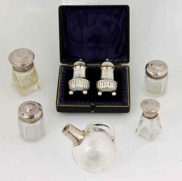 Appraisal: A pair of silver pepper pots H T Birmingham of