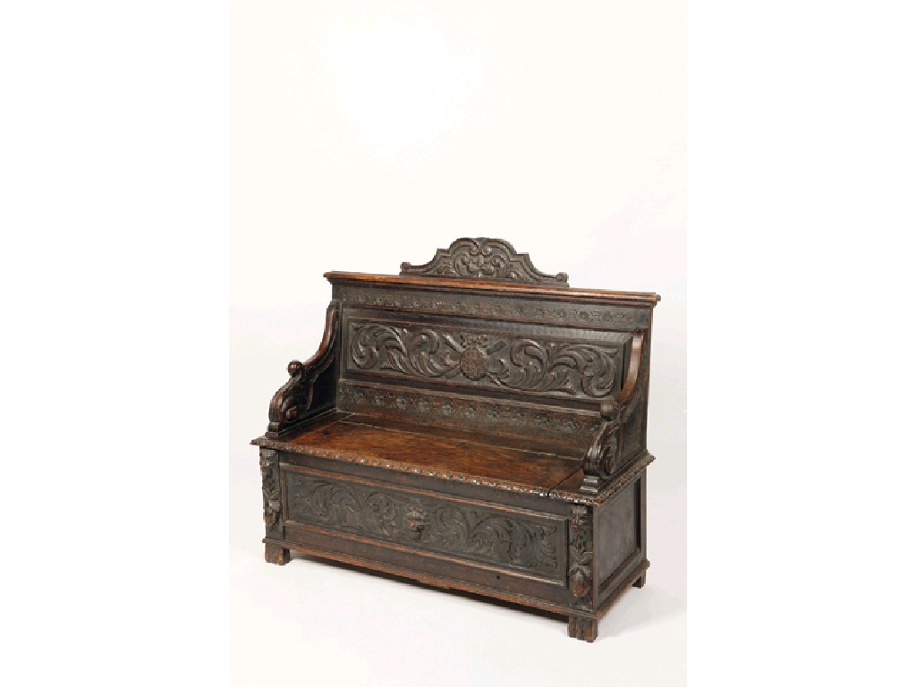 Appraisal: A CAROLEAN REVIVAL HALL BENCH with carved scrolling back panel