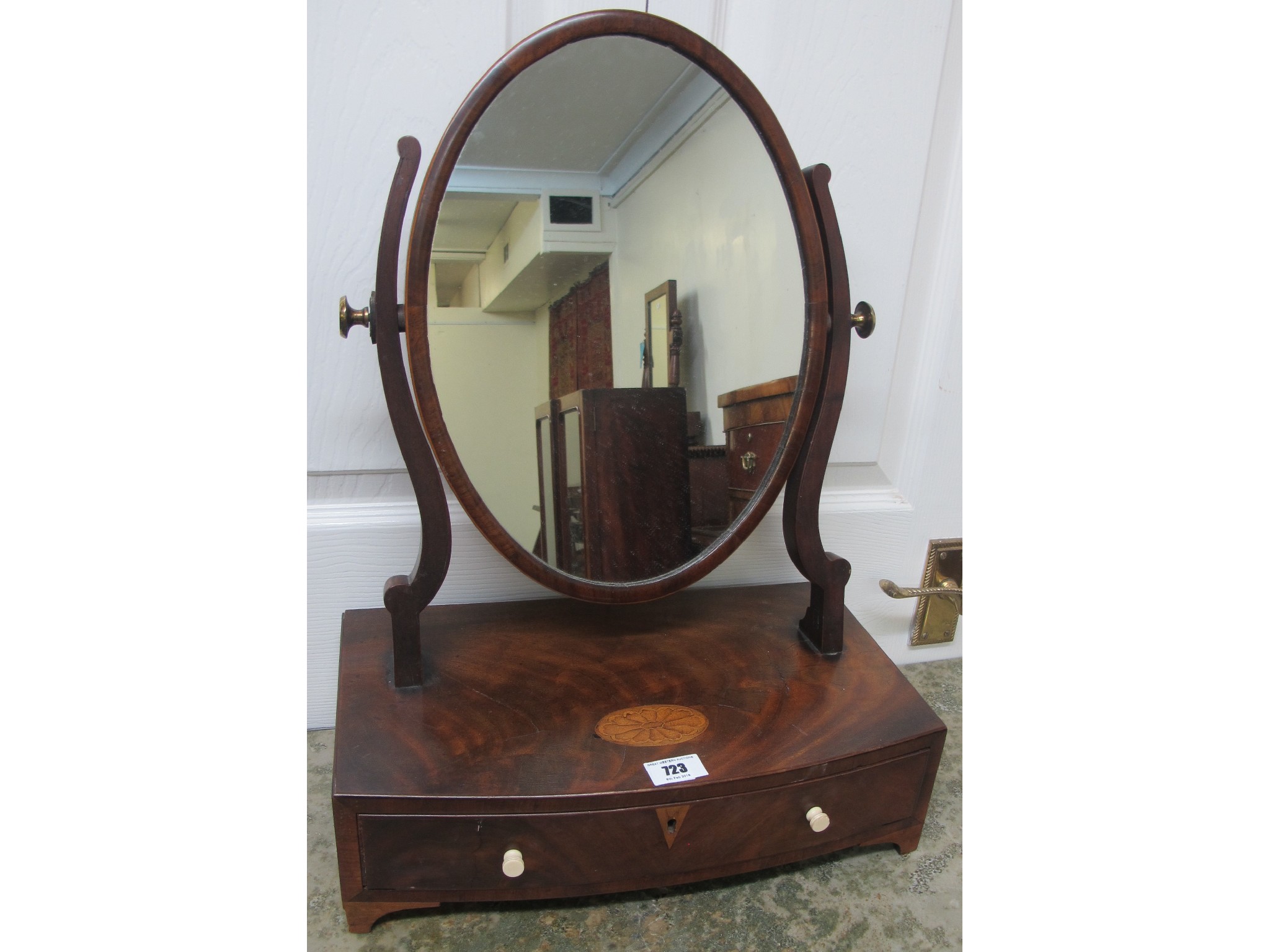 Appraisal: A mahogany small oval dressing mirror