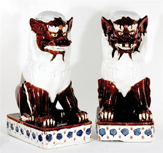 Appraisal: Pair Chinese ceramic foo lion figures seat creatures decorated with