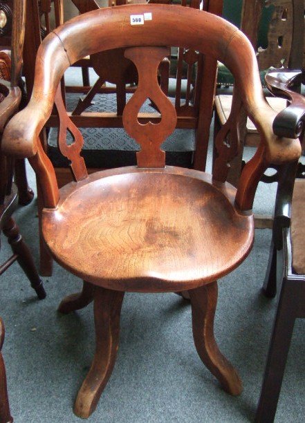 Appraisal: A th century elm and fruit wood swivel office chair