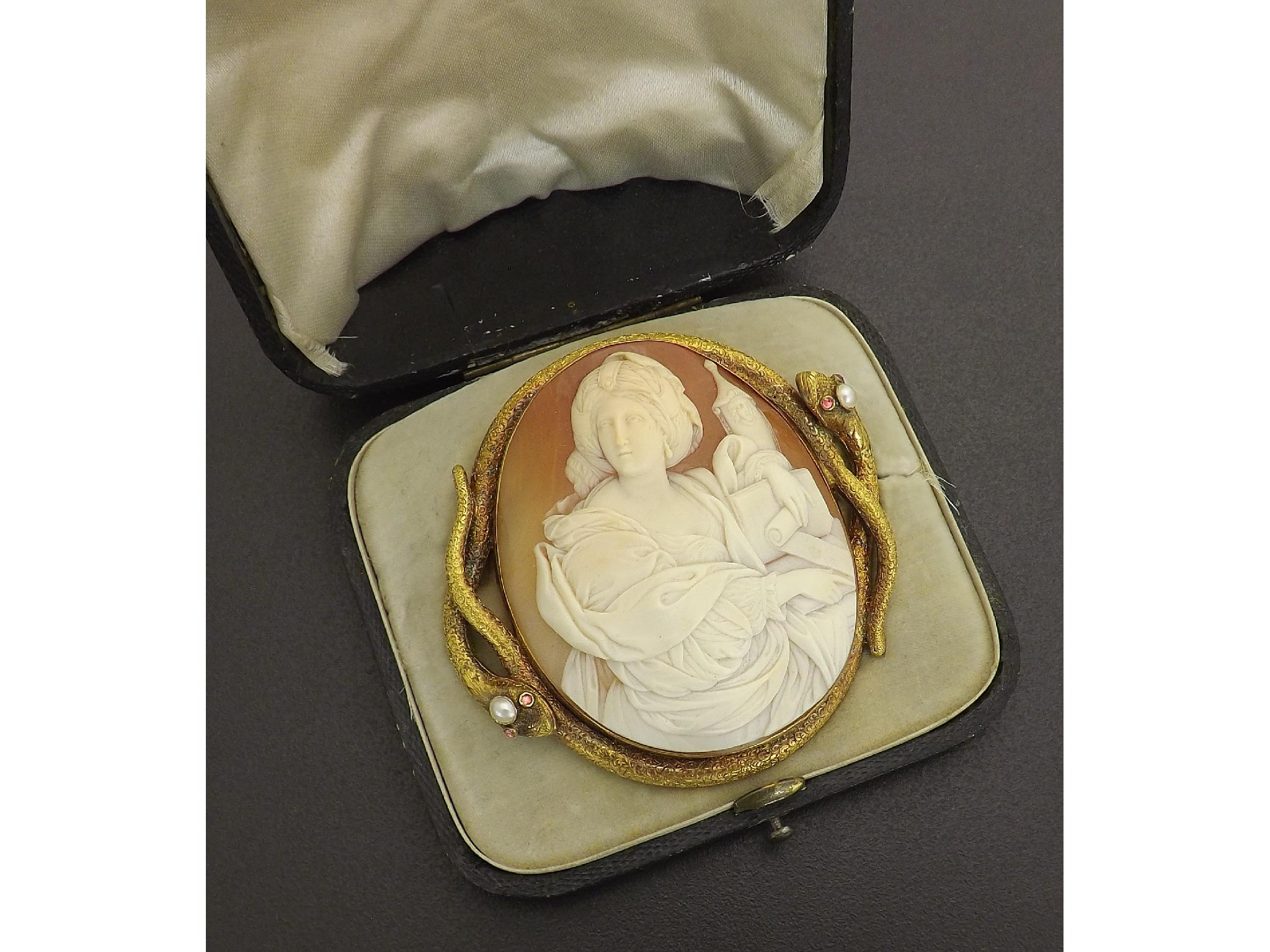 Appraisal: Good large Victorian oval cameo brooch depicting a lady holding