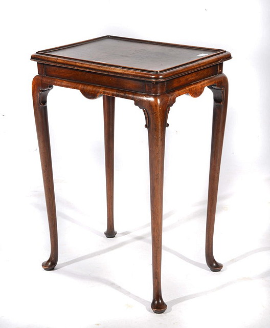 Appraisal: A CHARLES TOZER WALNUT SILVER TABLE with shaped legs and