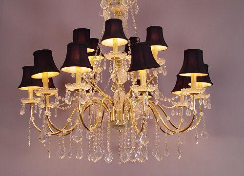 Appraisal: LARGE LIGHT BRASS AND CRYSTAL CHANDELIER brass arms lights diamond