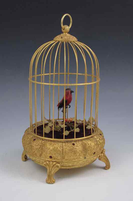 Appraisal: SINGING BIRD AUTOMATON Single bird with red and white feathers