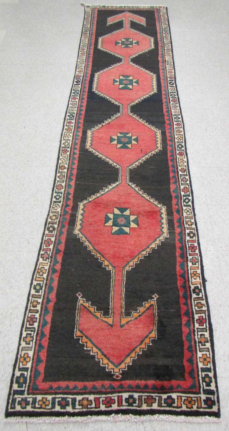 Appraisal: PERSIAN TRIBAL RUNNER featuring a column of four hexagonal pole