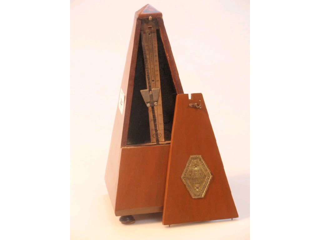 Appraisal: A Parquet Metronome in a mahogany case