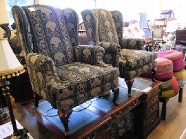 Appraisal: PAIR OF WING BACK ARM CHAIRS WITH MATCHING FOOT STOOL