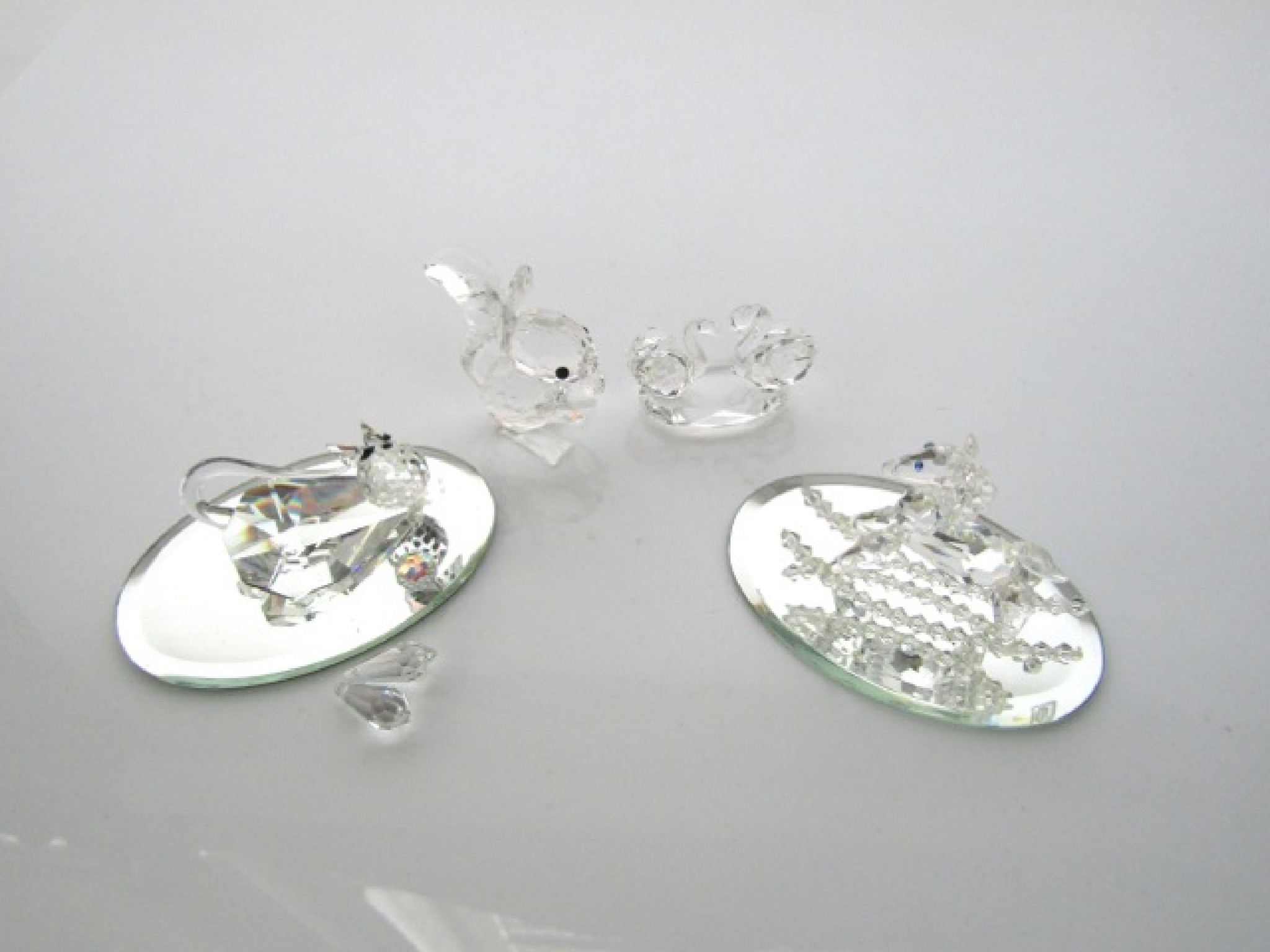 Appraisal: A Swarovski silver crystal model of a seated squirrel together