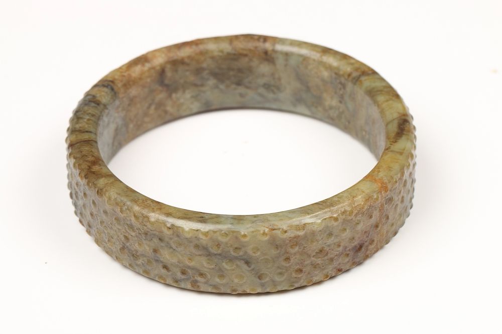 Appraisal: EARLY JADE BANGLE BRACELET Of a continuous circle bracelet the