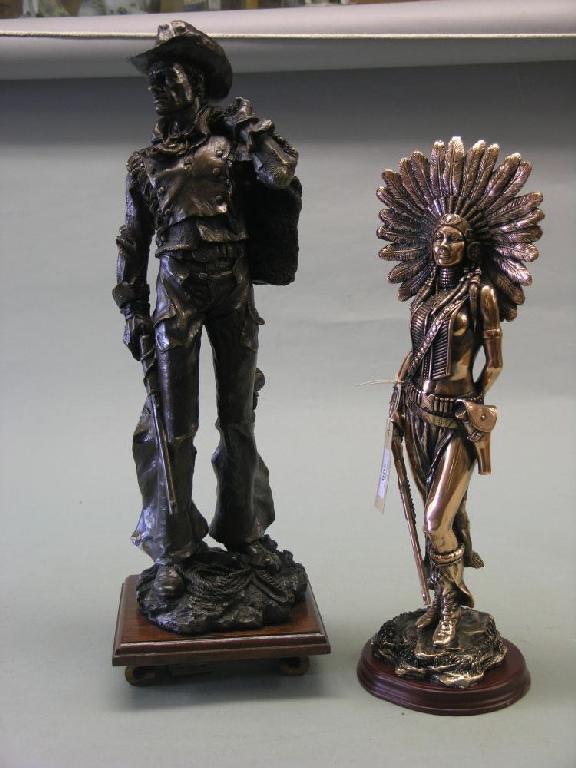 Appraisal: A modern copper finished statuette of a red Indian holding