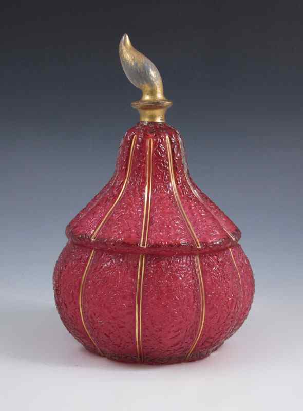 Appraisal: CRANBERRY BOHEMIAN GLASS COVERED JAR Cased glass jar ribbed body