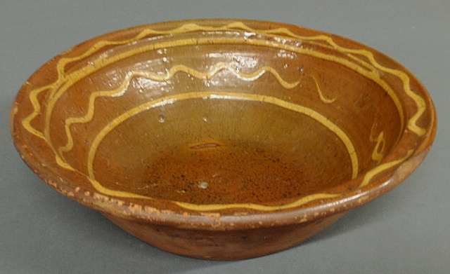 Appraisal: Redware bowl th c with yellow slip decoration h x