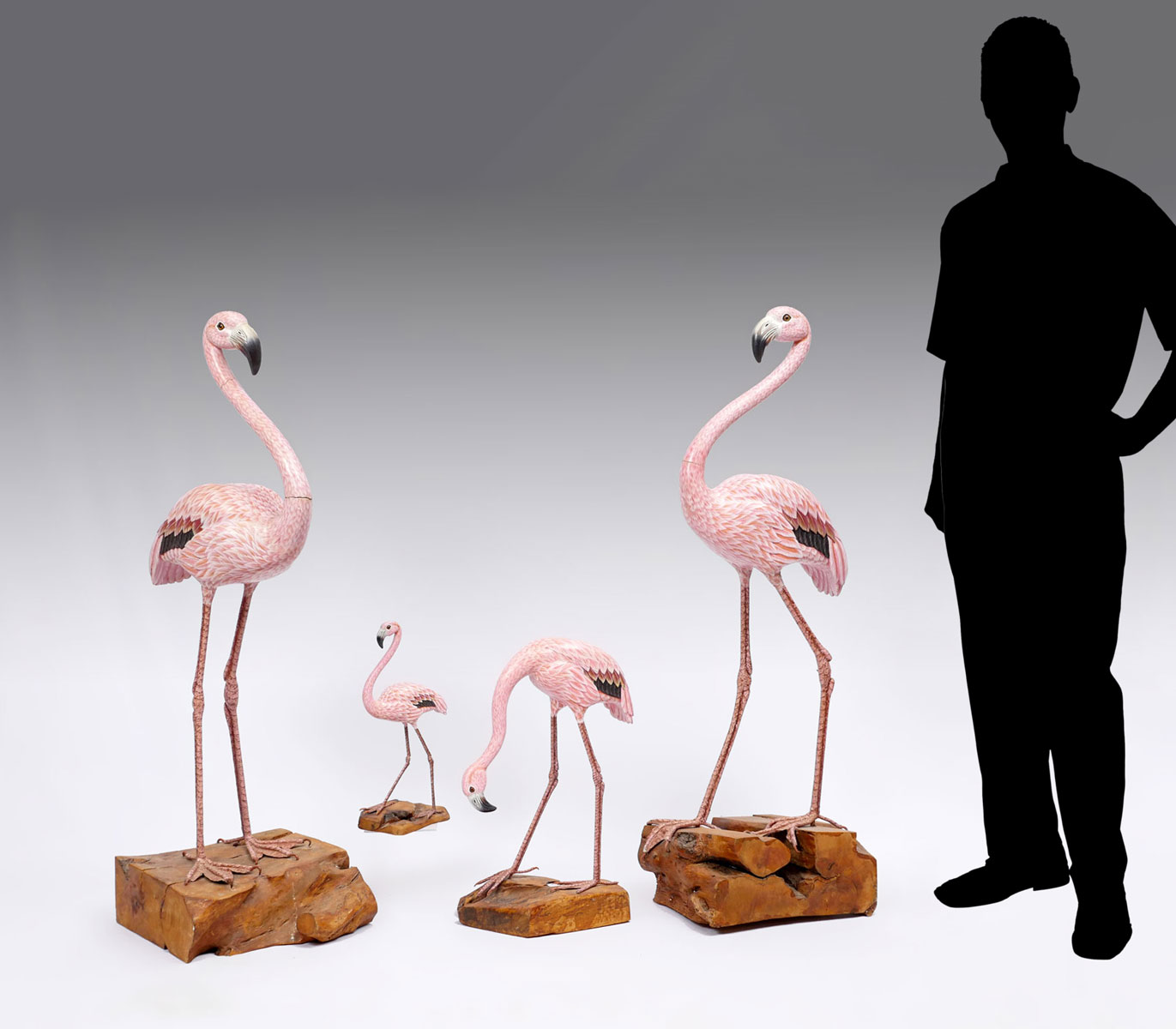 Appraisal: CARVED WOOD FLAMINGOS hand carved painted Flamingos having inset eyes