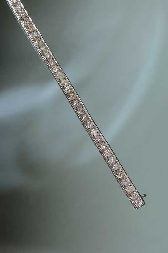 Appraisal: DIAMOND TENNIS BRACELET Diamond tennis bracelet comprised of numerous prong-set