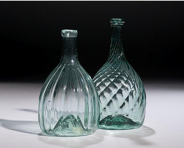 Appraisal: TWO MIDWESTERN PATTERN-MOLDED BOTTLES probably Mantua Ohio ca aqua glass