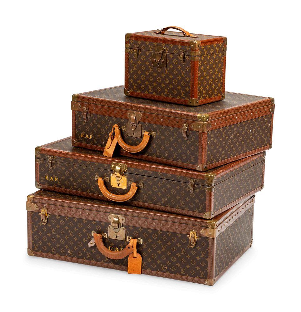 Appraisal: Four Louis Vuitton Hard-Sided Suitcases Four Louis Vuitton Hard-Sided Suitcases