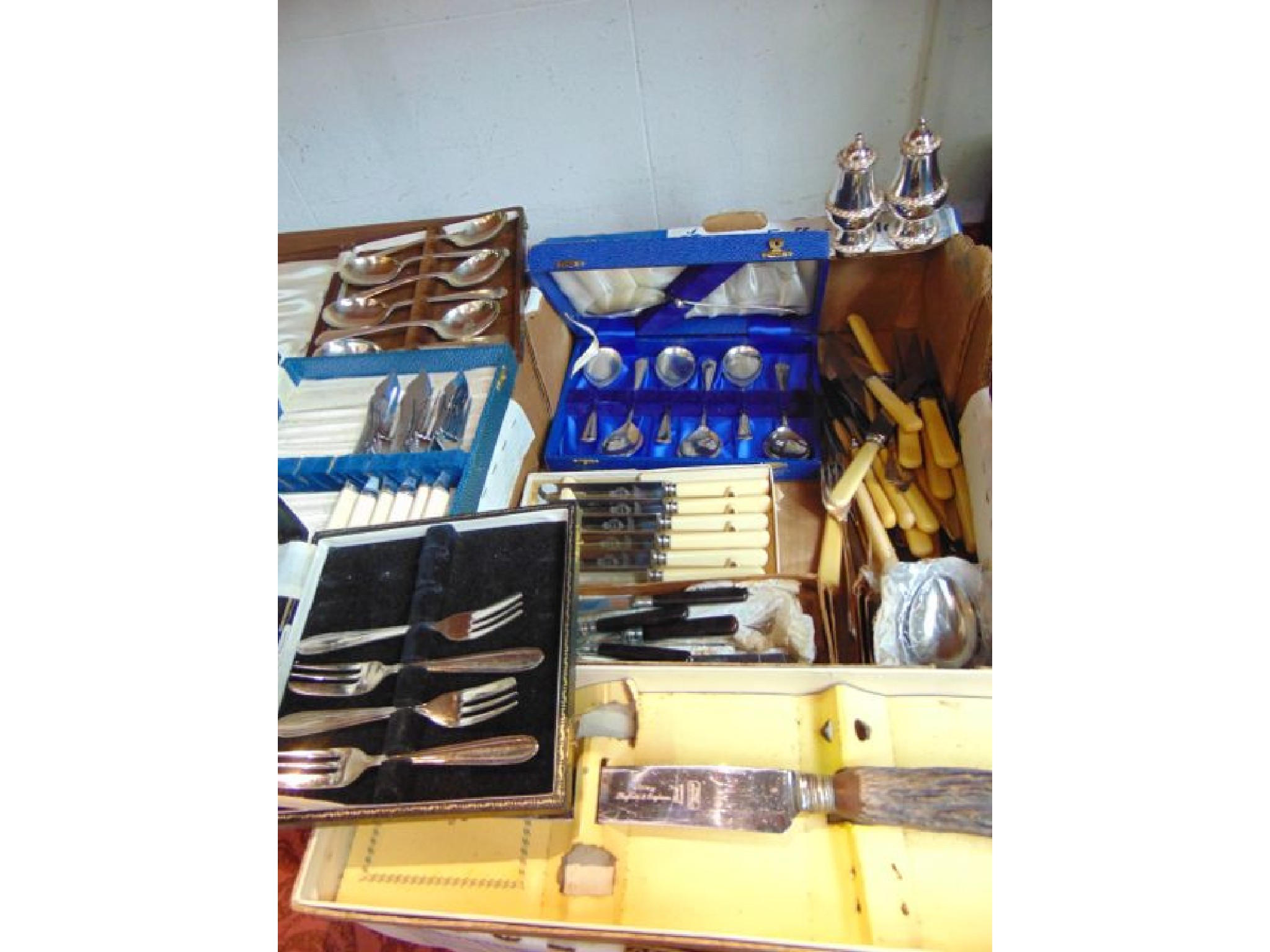 Appraisal: A quantity of boxed and cased plated flatware including soup