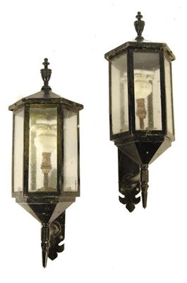 Appraisal: A pair of painted iron hexagonal wall lanterns having glass