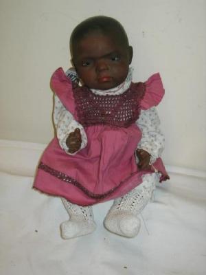 Appraisal: A Heubach bisque head negro baby doll with brown glass