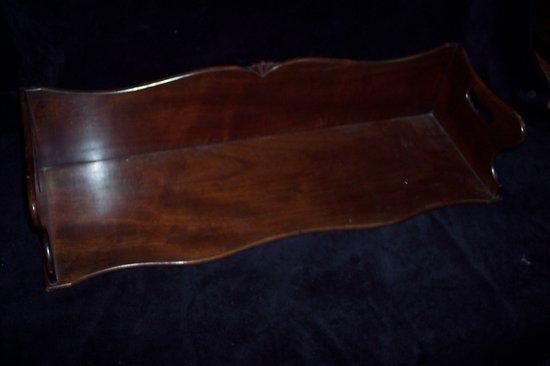 Appraisal: A William IV mahogany book tray with cut out handles