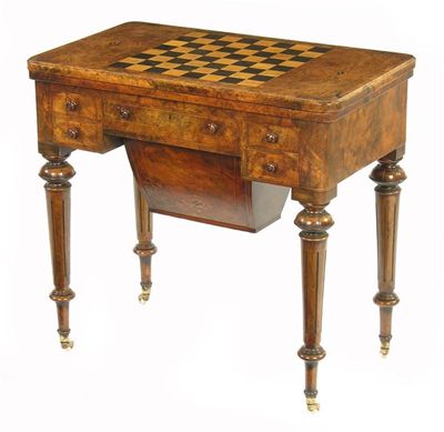 Appraisal: A Victorian walnut games table the burr walnut swivel hinged