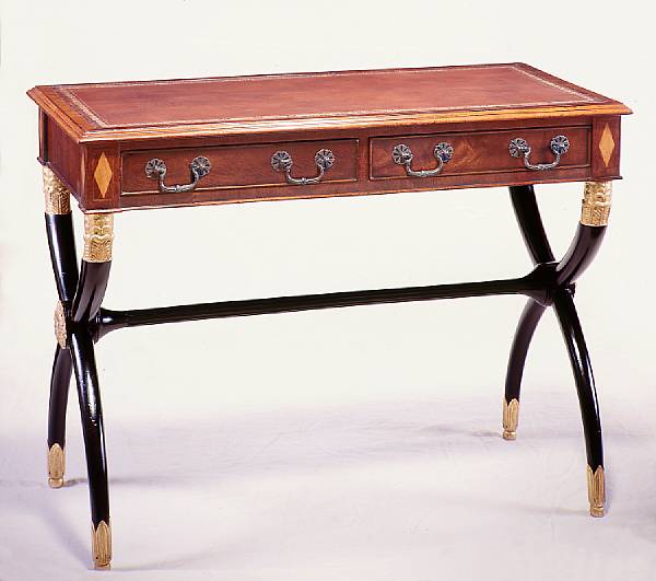 Appraisal: A Regency style mahogany parcel gilt and ebonized writing table