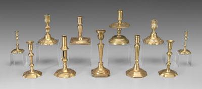 Appraisal: Eleven brass candlesticks includes one pair with canted corners -