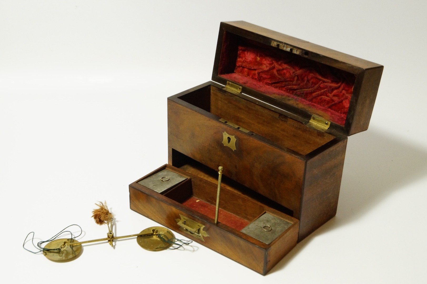 Appraisal: A Victorian flamed mahogany apothecary box with scales to drawer