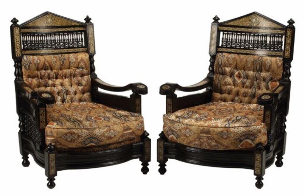 Appraisal: MOORISH STYLE EBONIZED INLAID ARMCHAIRS pair Moorish style ebonized and