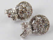 Appraisal: A pair of rhodium plated metal tests carat gold diamond