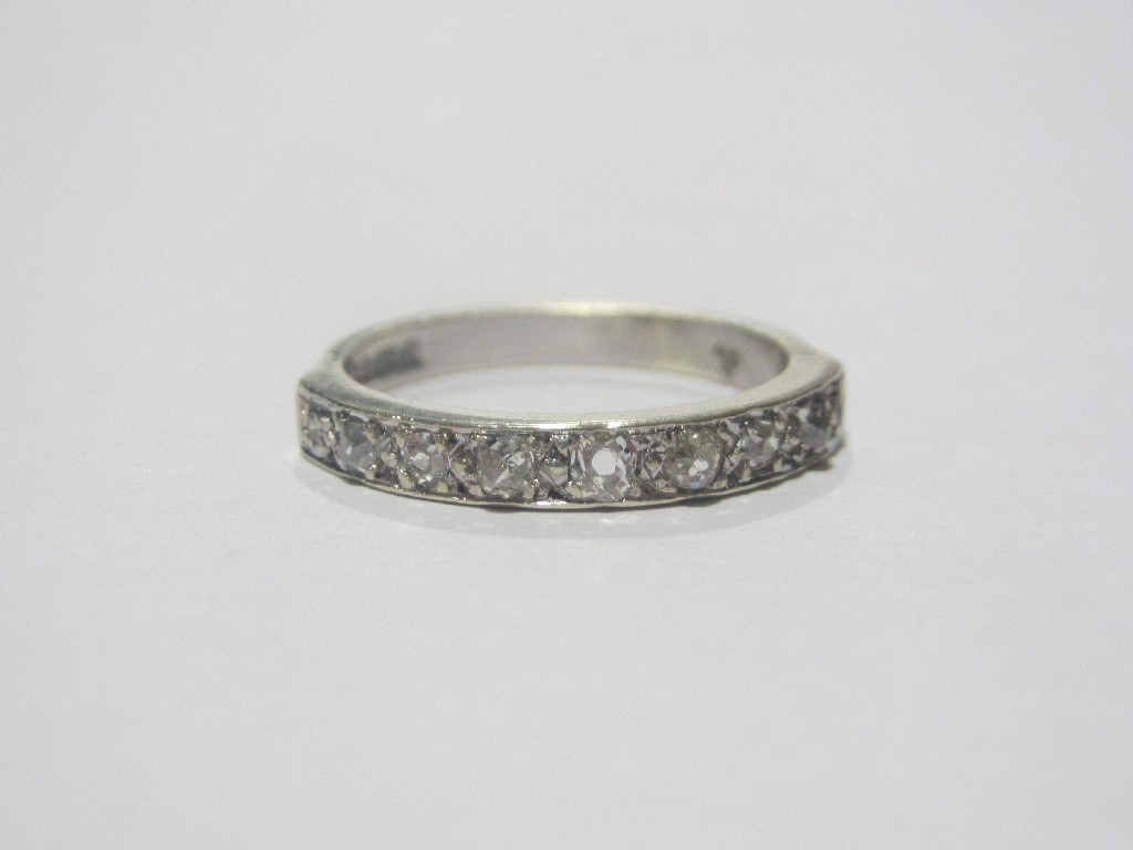 Appraisal: Nine carat white gold diamond half hoop ring