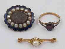 Appraisal: A mixed lot comprising an enamel and pearl mourning brooch