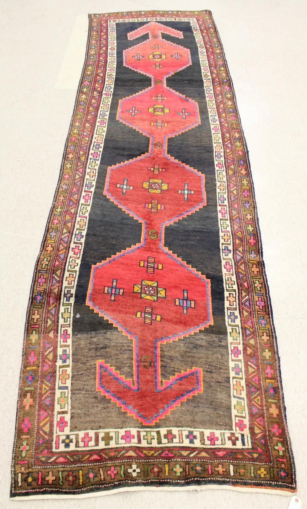 Appraisal: HAND KNOTTED PERSIAN TRIBAL AREA RUG having four hexagonal pole