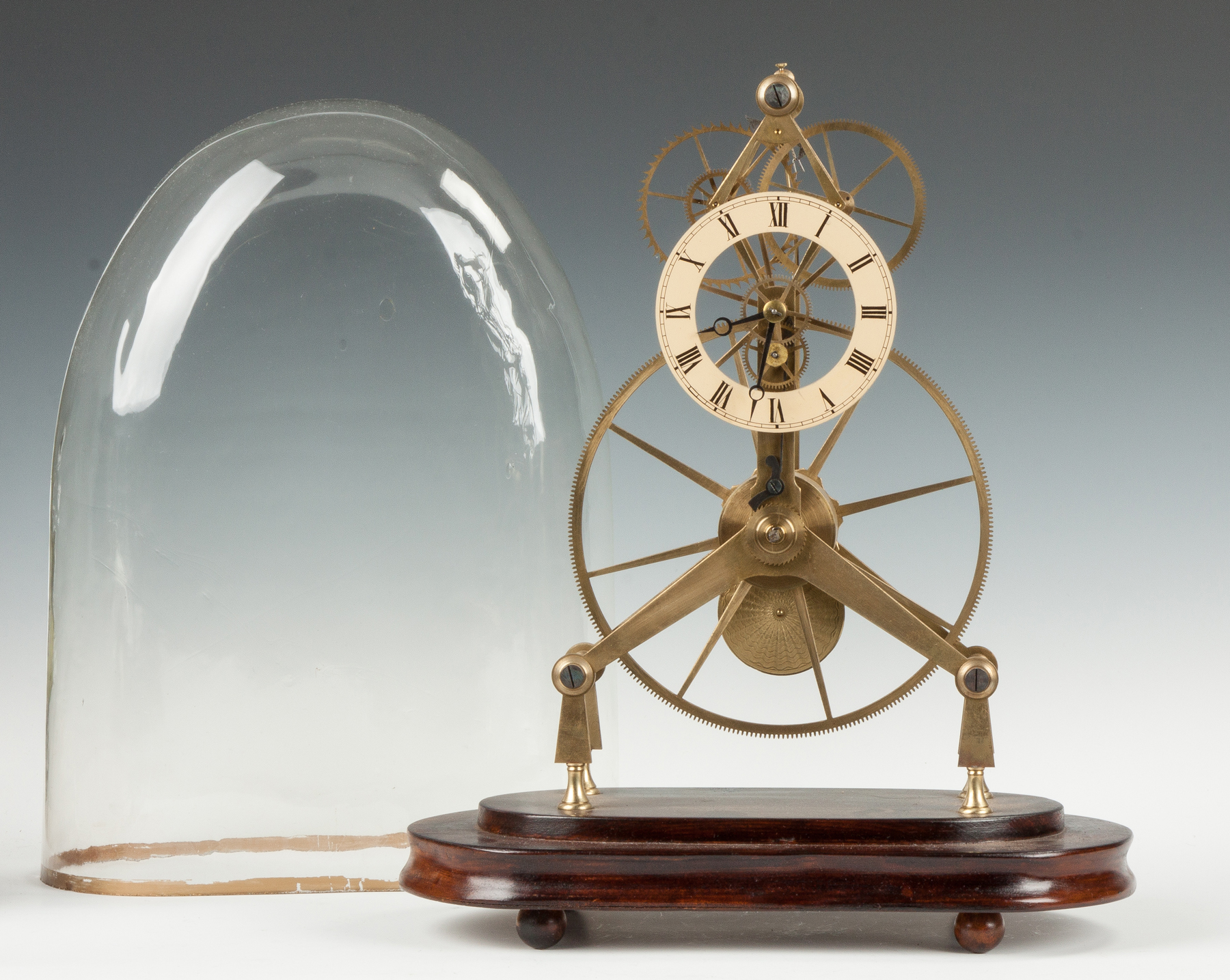 Appraisal: English Large Wheel Brass Skeleton Clock With silver engraved dial