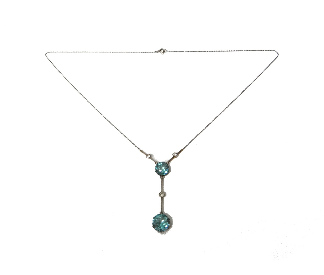 Appraisal: A blue zircon and diamond set pendant necklace claw set