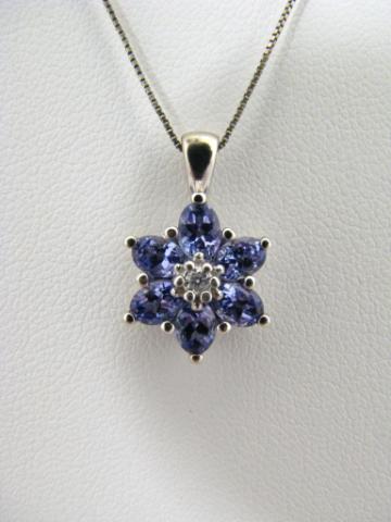 Appraisal: K White Gold cluster pendant on with six tanzanite and