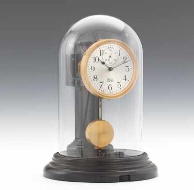 Appraisal: A Poole Manufacturing Co Battery Clock with Glass Dome The