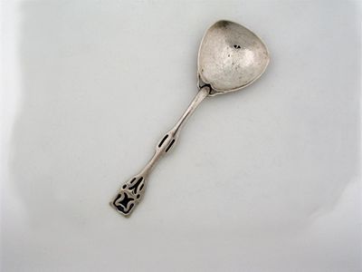 Appraisal: An art nouveau spoon with grain shovel hammer bowl the