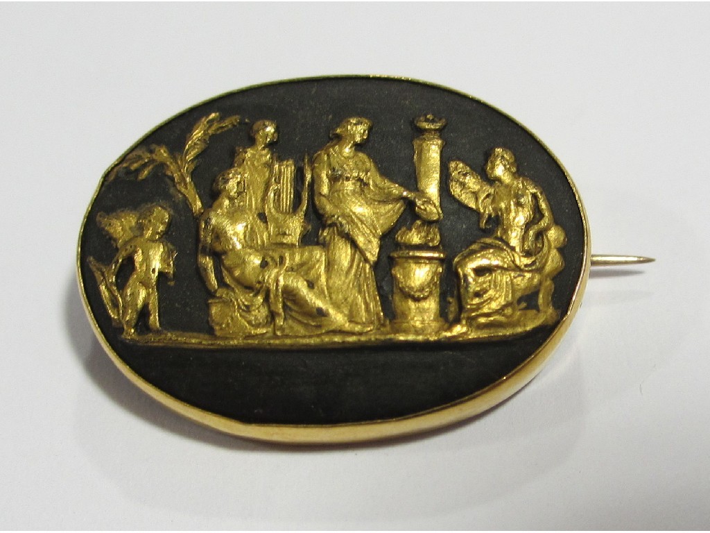 Appraisal: A Wedgwood oval brooch with gilt decorated relief panel depicting